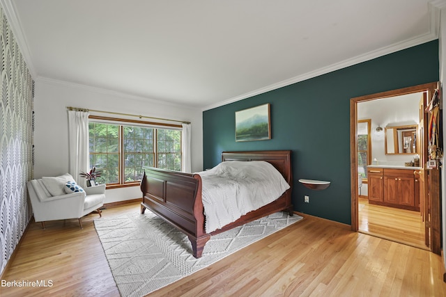 67 Dunmore Ct, Lenox, MA 01240 - bedroom featuring light wood-type flooring, ornamental molding, and connected bathroom