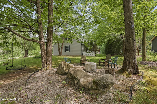 67 Dunmore Ct, Lenox, MA 01240 - view of green lawn with a fire pit