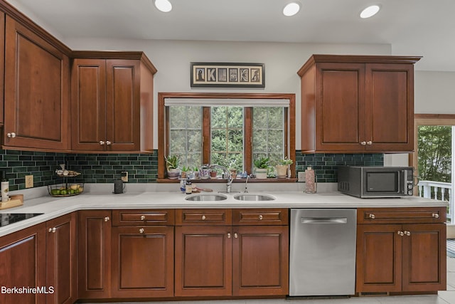 67 Dunmore Ct, Lenox, MA 01240 - kitchen with stainless steel appliances, light countertops, decorative backsplash, and recessed lighting