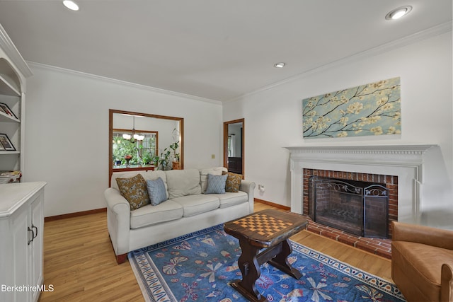67 Dunmore Ct, Lenox, MA 01240 - living room featuring crown molding, light wood-type flooring, recessed lighting, and a brick fireplace