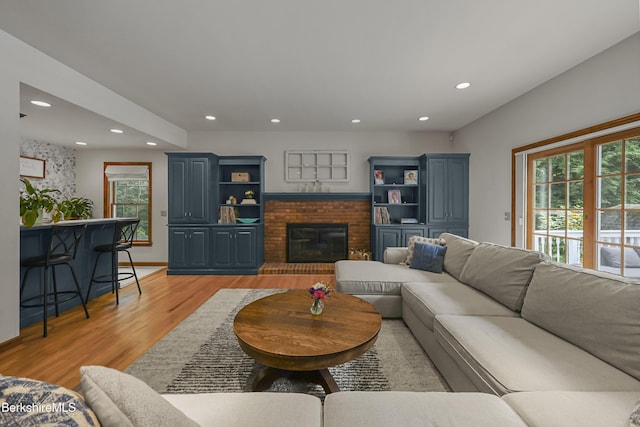 67 Dunmore Ct, Lenox, MA 01240 - living area featuring light wood finished floors, recessed lighting, and a fireplace