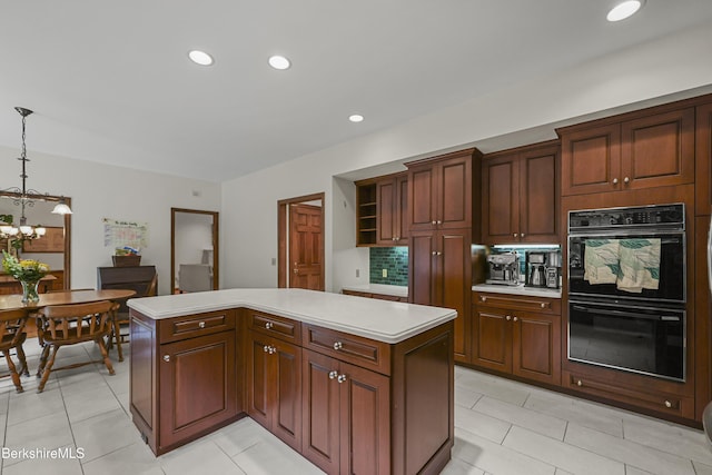 67 Dunmore Ct, Lenox, MA 01240 - kitchen with a center island, light countertops, tasteful backsplash, pendant lighting, and open shelves
