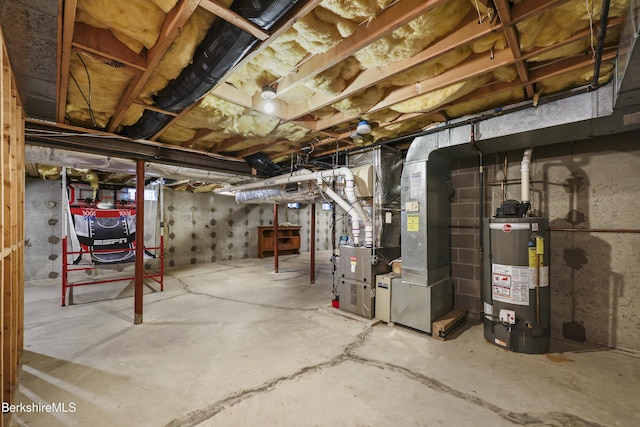 67 Dunmore Ct, Lenox, MA 01240 - unfinished basement featuring water heater and heating unit