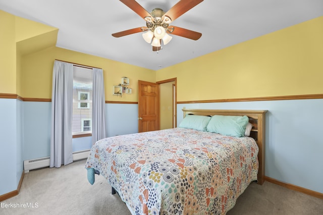 carpeted bedroom with baseboards, a baseboard radiator, and ceiling fan