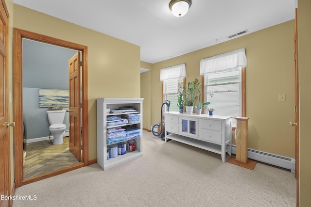 miscellaneous room featuring carpet floors, baseboards, and visible vents