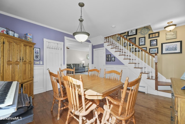 dining space with a decorative wall, ornamental molding, stairway, and dark wood-type flooring