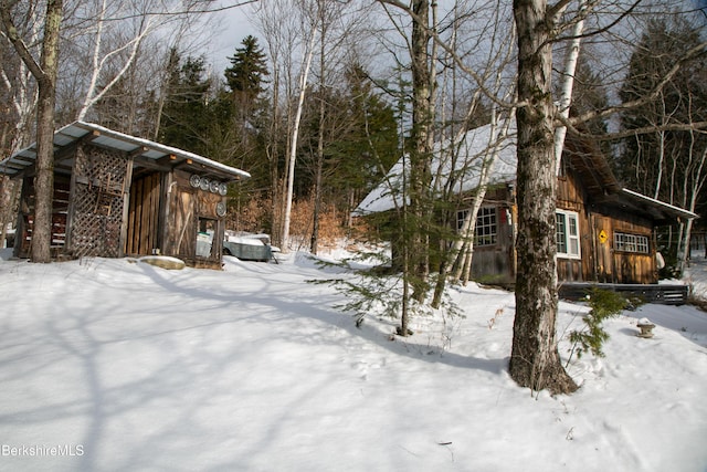 view of yard layered in snow