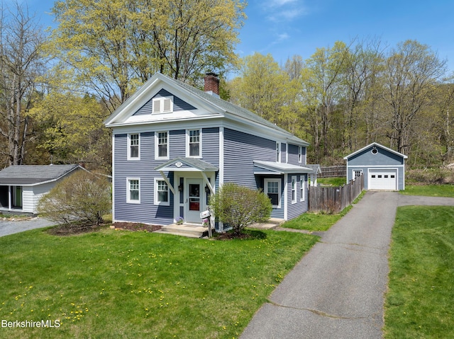 neoclassical / greek revival house featuring an outdoor structure, driveway, a chimney, and a detached garage