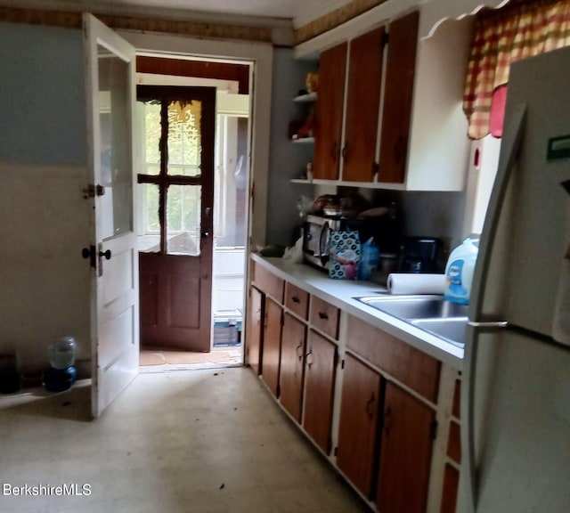 kitchen with white fridge and sink