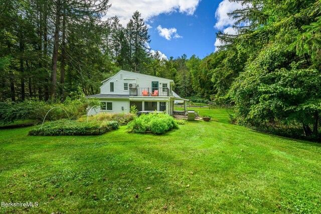 270 Hillsdale Rd, Egremont, MA 01258 - rear view of house with a wooded view, a vegetable garden, and a wooden deck