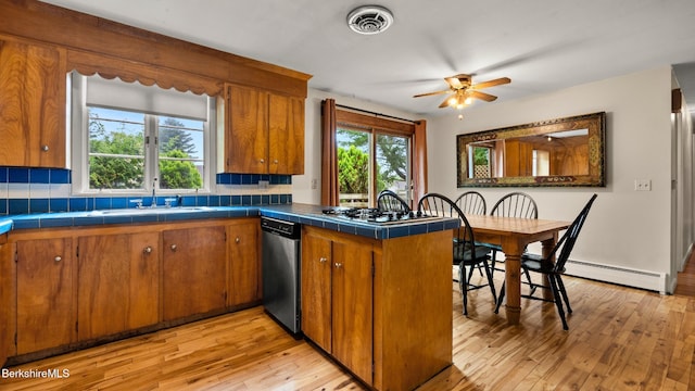 33 Quirico Dr, Pittsfield, MA 01201 - kitchen with stainless steel appliances, brown cabinets, and tile counters