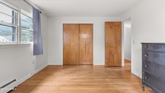 33 Quirico Dr, Pittsfield, MA 01201 - unfurnished bedroom featuring a baseboard radiator, light wood finished floors, and a closet
