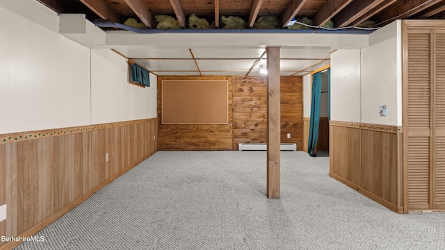 33 Quirico Dr, Pittsfield, MA 01201 - finished basement with wood walls, carpet flooring, a baseboard heating unit, and a wainscoted wall
