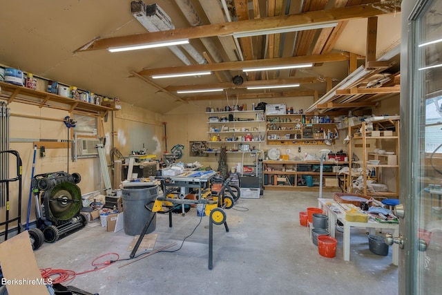 garage with a workshop area and cooling unit