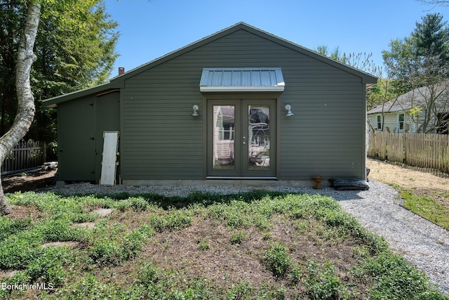 rear view of property with fence