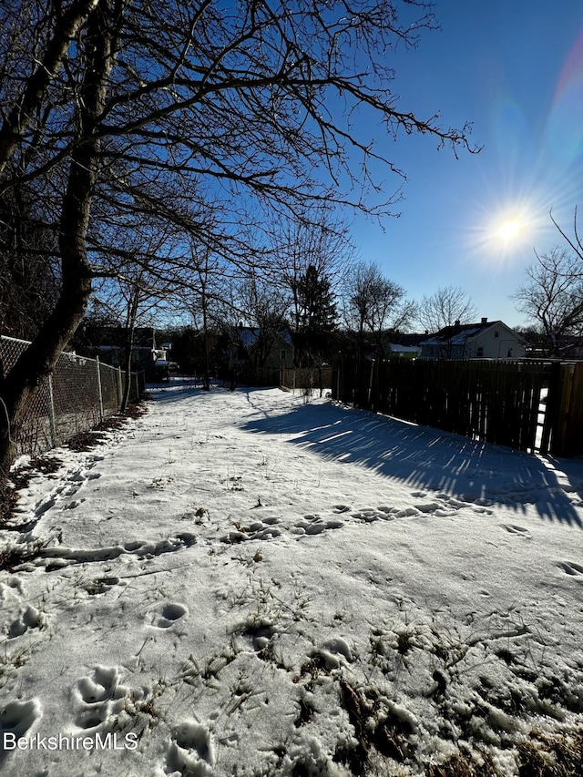 view of yard covered in snow