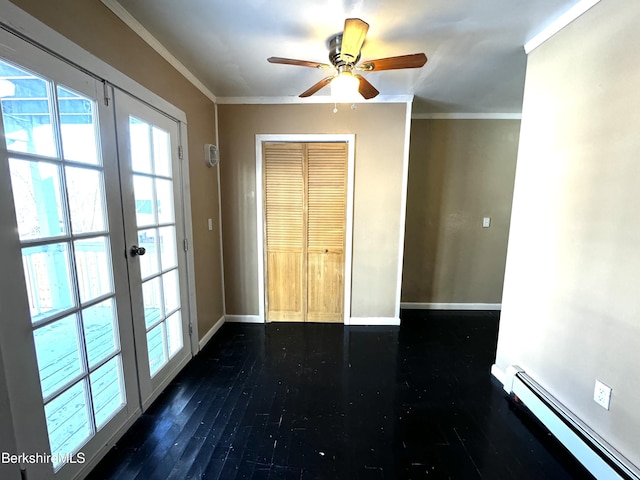 entryway featuring dark hardwood / wood-style floors, ornamental molding, french doors, and baseboard heating