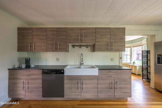 12 Riverfront St, Chester, MA 01011 - kitchen featuring a sink, light wood-type flooring, crown molding, dark countertops, and appliances with stainless steel finishes