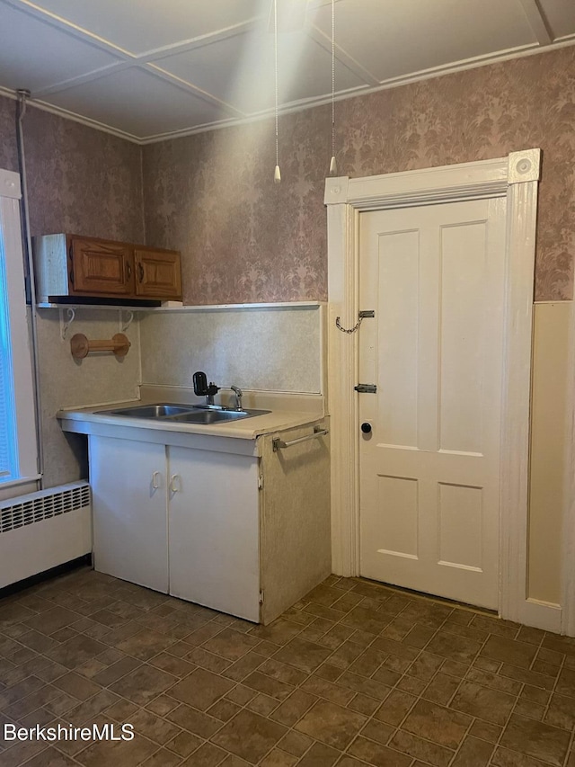 kitchen featuring sink and radiator