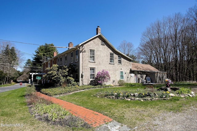 view of home's exterior with a lawn