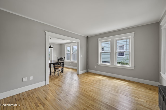 56 Perrine Ave, Pittsfield, MA 01201 - empty room with crown molding, light wood-style flooring, and radiator