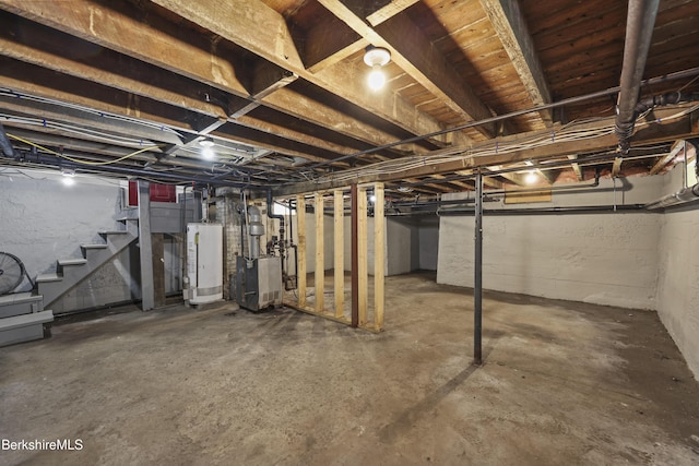 56 Perrine Ave, Pittsfield, MA 01201 - unfinished below grade area with gas water heater, stairs, and a heating unit