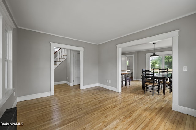 56 Perrine Ave, Pittsfield, MA 01201 - living area featuring light wood-style flooring, ornamental molding, and stairway