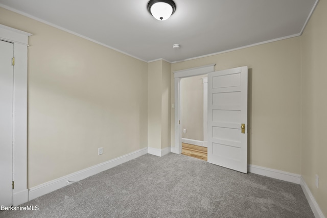 56 Perrine Ave, Pittsfield, MA 01201 - spare room featuring carpet flooring, crown molding, and a smoke detector