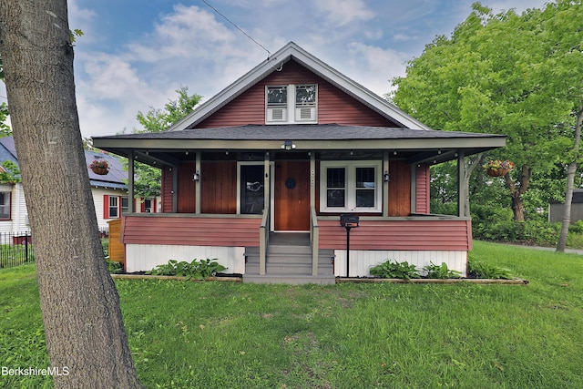 88 Newell St, Pittsfield, MA 01201 - view of front of house with a front lawn, roof with shingles, entry steps, and a porch