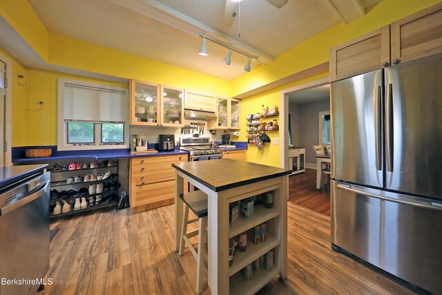88 Newell St, Pittsfield, MA 01201 - kitchen featuring stainless steel appliances, open shelves, under cabinet range hood, wood finished floors, and butcher block countertops