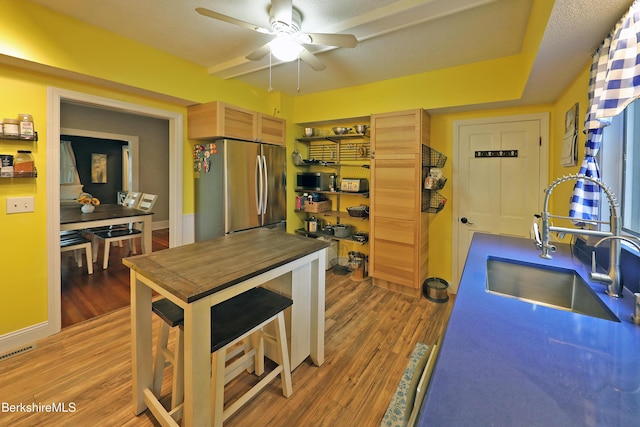 88 Newell St, Pittsfield, MA 01201 - kitchen with ceiling fan, wood finished floors, and stainless steel appliances