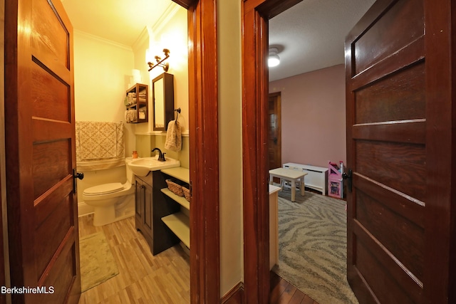 88 Newell St, Pittsfield, MA 01201 - bathroom featuring vanity, ornamental molding, and wood finished floors