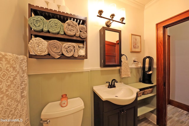 88 Newell St, Pittsfield, MA 01201 - bathroom with vanity, ornamental molding, a wainscoted wall, and wood finished floors