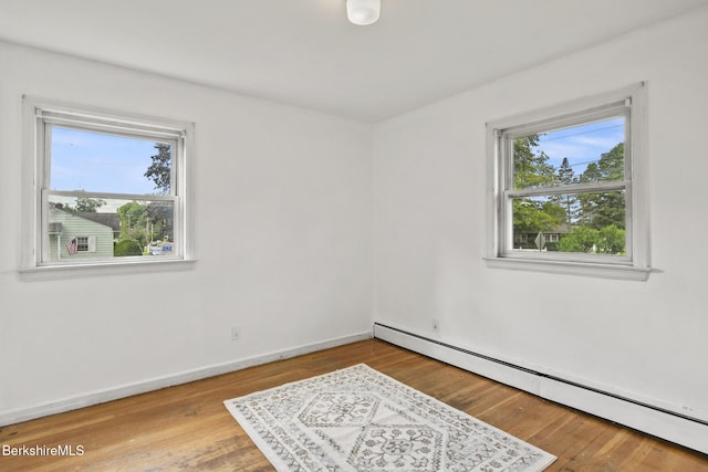 36 Dalton Division Rd, Dalton, MA 01226 - unfurnished room with a baseboard heating unit and wood finished floors
