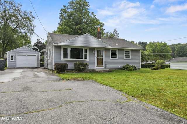 36 Dalton Division Rd, Dalton, MA 01226 - view of front facade featuring an outbuilding, driveway, a front lawn, a chimney, and a shingled roof