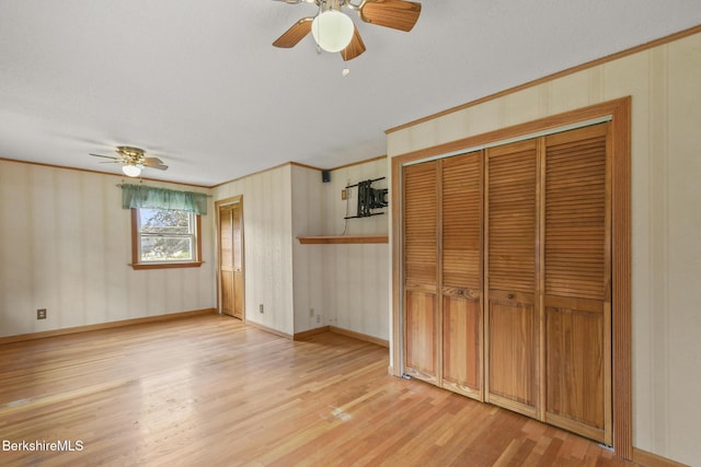36 Dalton Division Rd, Dalton, MA 01226 - unfurnished bedroom with crown molding, light wood-type flooring, a closet, and ceiling fan