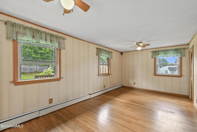 36 Dalton Division Rd, Dalton, MA 01226 - unfurnished room with ceiling fan, baseboard heating, a textured ceiling, light wood-type flooring, and healthy amount of natural light