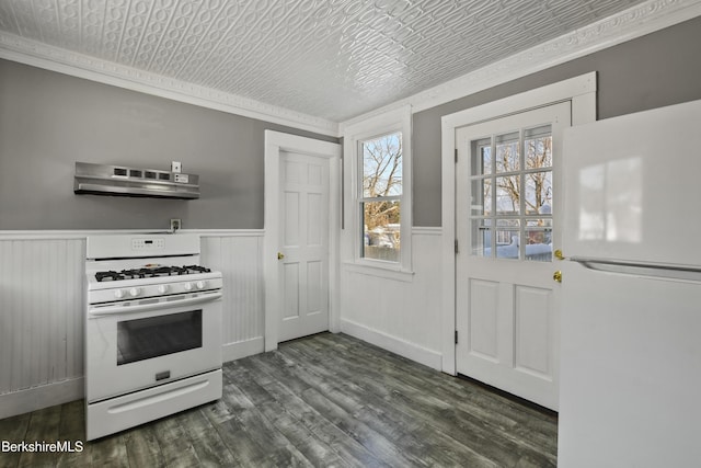 kitchen featuring white appliances, dark hardwood / wood-style floors, ornamental molding, and exhaust hood