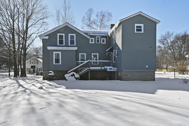 view of snow covered house