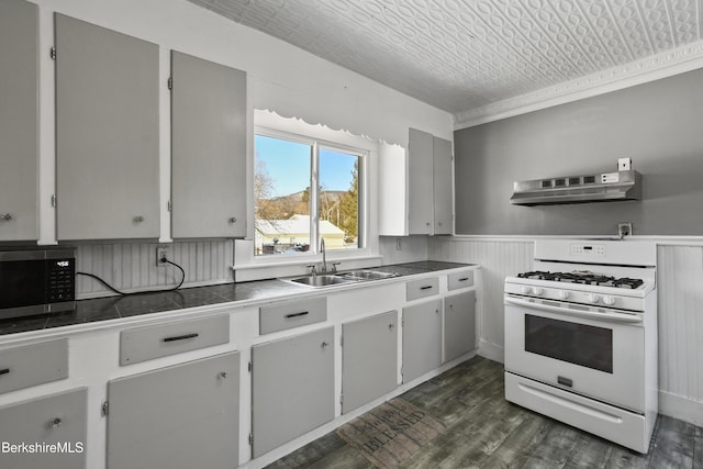 kitchen with sink, crown molding, dark wood-type flooring, white range with gas stovetop, and ventilation hood