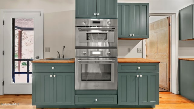173 Hillsdale Rd, Egremont, MA 01258 - kitchen with green cabinets, double oven, butcher block countertops, and light wood-style floors