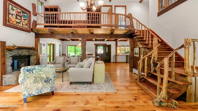 173 Hillsdale Rd, Egremont, MA 01258 - living area with a towering ceiling, stairs, wood-type flooring, and a chandelier