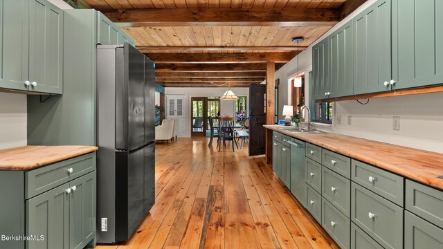 173 Hillsdale Rd, Egremont, MA 01258 - kitchen featuring green cabinetry, freestanding refrigerator, light wood finished floors, a wooden ceiling with exposed beams, and stainless steel dishwasher