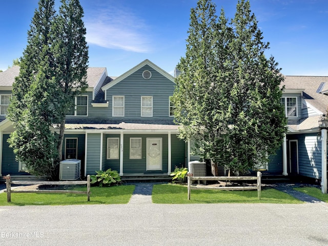 9253 Mountainside Dr, Hancock, MA 01237 - view of front facade featuring cooling unit, a shingled roof, and covered porch
