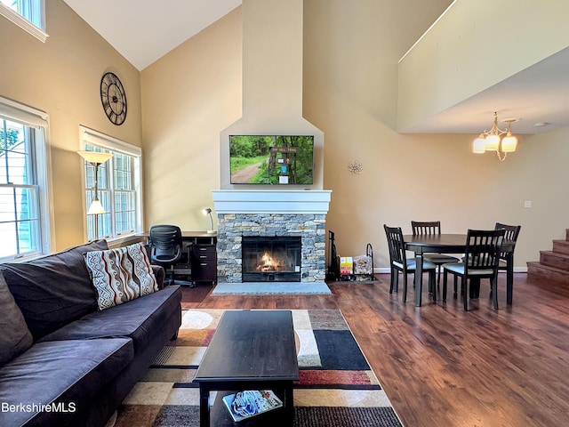 9253 Mountainside Dr, Hancock, MA 01237 - living area with an inviting chandelier, a stone fireplace, wood finished floors, and high vaulted ceiling