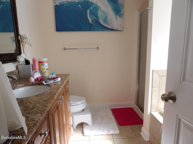 full bath with tile patterned flooring, toilet, vanity, baseboards, and a shower stall