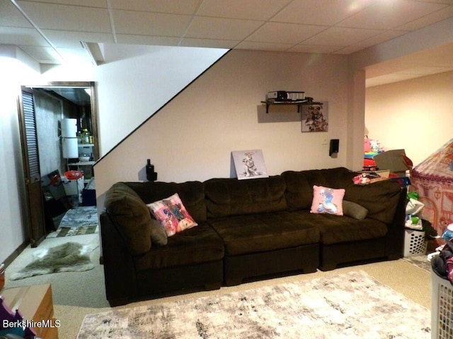 living room with a paneled ceiling