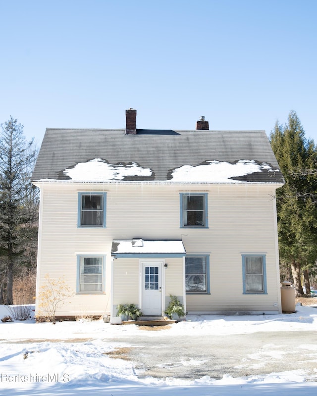 view of snow covered house