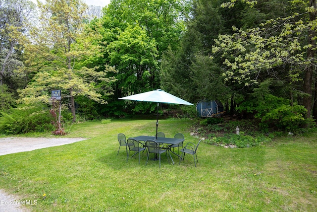 26 High St, West Stockbridge, MA 01266 - view of grassy yard with a storage unit, an outdoor structure, and outdoor dining area