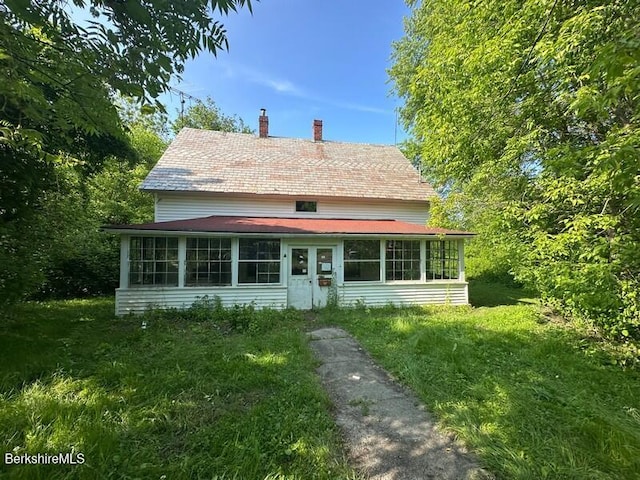 425 Barbour St, North Adams, MA 01247 - view of front of property featuring a sunroom and a chimney